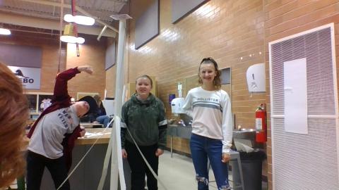 STEM students showing their newspaper tower