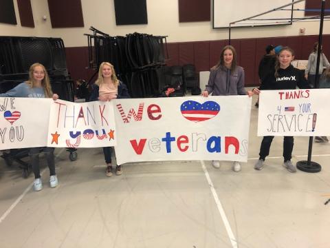 Students making Veteran's day posters
