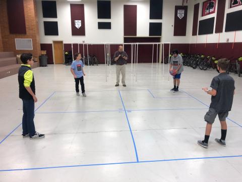 Students playing 4 square