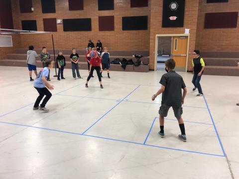 Students playing 4 square