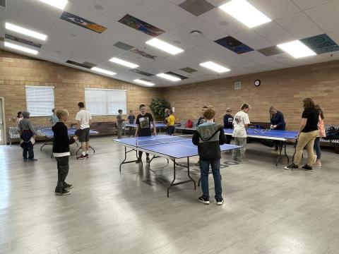 Students playing ping pong.