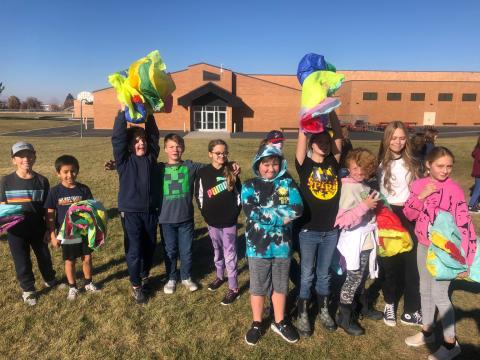 Students with hot air balloons they made