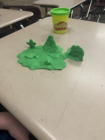 Students creating playdough landforms